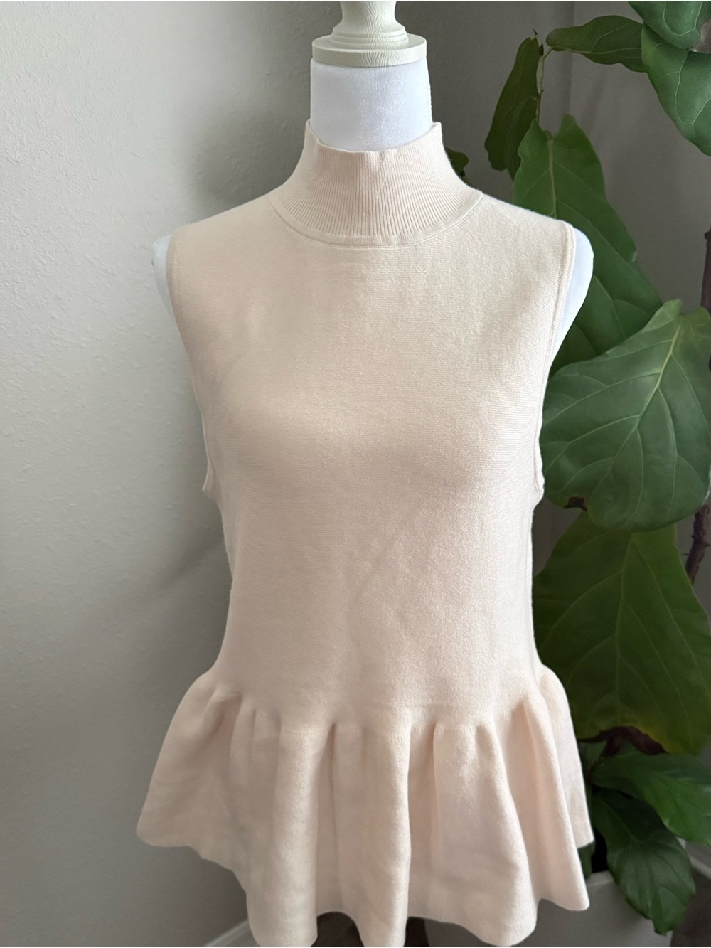 Fate Cream Sleeveless Mock Neck Peplum Tank